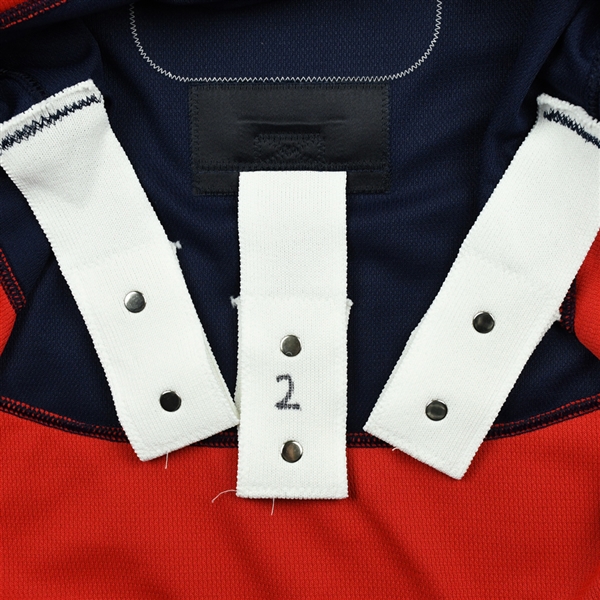 strap on back of hockey jersey