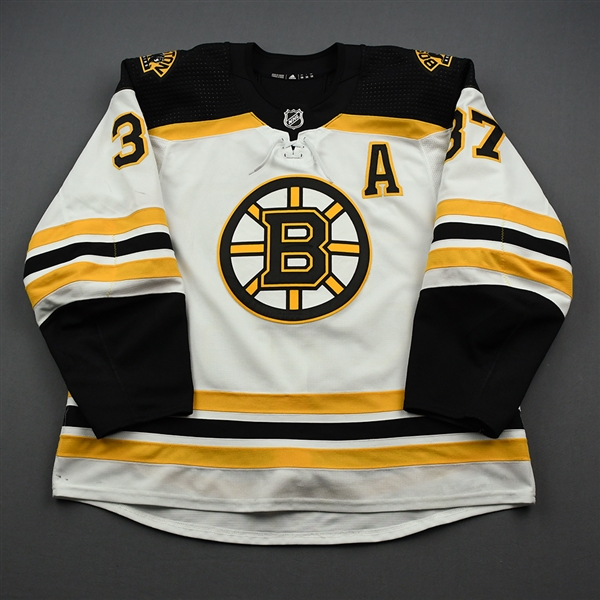 Bergeron, Patrice<br>White Set 1 w/A<br>Boston Bruins 2019-20<br>#37 Size: 58