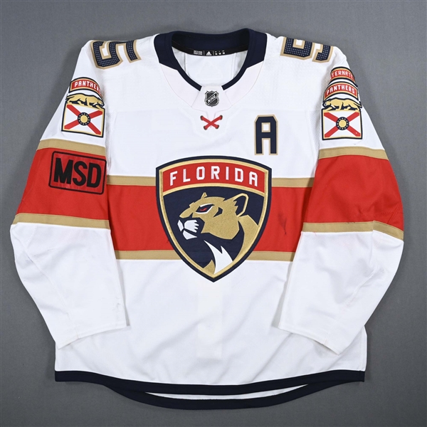 Ekblad, Aaron *<br>White Set 2 w/A, w/ MSD Patch<br>Florida Panthers 2017-18<br>#5Size: 58