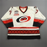 Leschyshyn, Curtis *<br>White Airknit w/ Inaugural, Millenium & Steve Chiasson Memorial Patches<br>Carolina Hurricanes 1999-00<br>#7 Size: 56