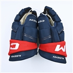 Alexeyev, Alexander<br>CCM HGQL Gloves - Worn in Stadium Series Practice & Warm-Up<br>Washington Capitals 2022-23<br>#27 Size: 14"